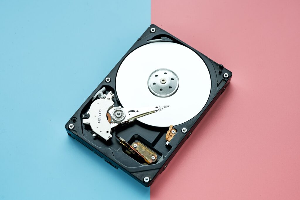 Comparison chart of SSD vs HDD showing speed, cost, and performance differences"
"SSD and HDD side by side, highlighting their physical differences"
"SSD being installed in a laptop for faster performance"
"Illustration of data transfer speeds between SSD and HDD"
"Comparison of boot times on a computer with SSD versus HDD"
"Close-up of an SSD drive showcasing its sleek design"